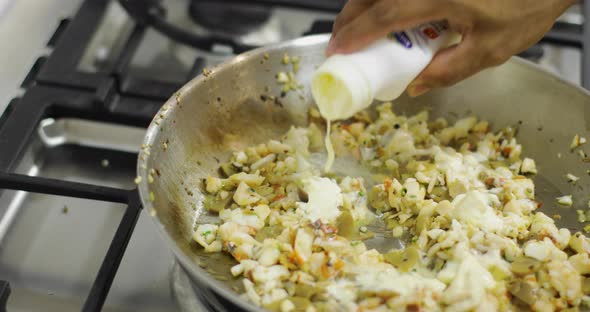 Mixing Cream Into Seafood Dish