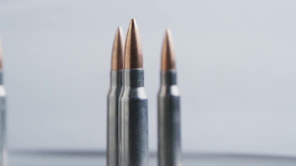 Cinematic rotating shot of bullets on a metallic surface - BULLETS 026