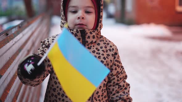 Ukrainian Kid Outdoors in Poltava Ukraine with Flag of the Country