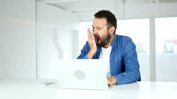 Yawning Tired Man in Office Want to Sleep