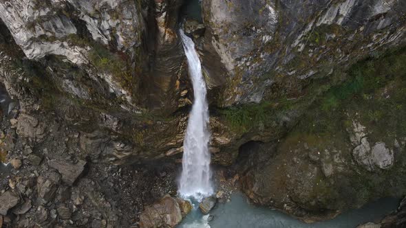 Chame Waterfall flowing into the Marsyangdi River flying overhead