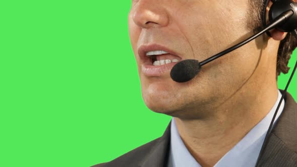 close up of business male talking on headphone
