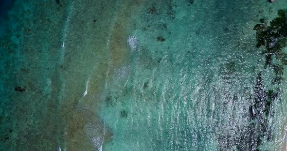 Wide angle aerial abstract view of a summer white paradise sand beach and blue sea background 