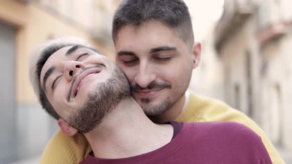 Lgbt Gay Male Couple Having Tender Moment Hugging Outdoor in the City