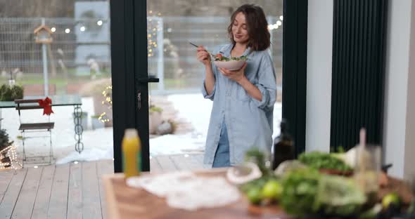 Woman Feeling Well with Healthy Food at Home