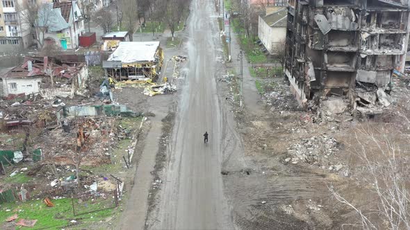 Cyclist Riding in the Middle of a Russiandestroyed City