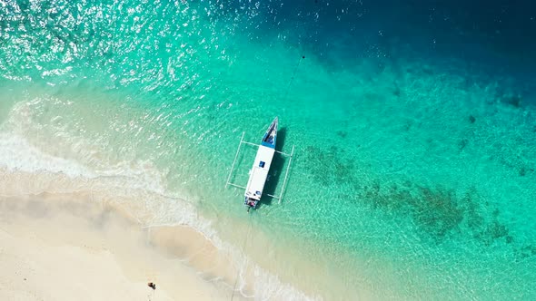 Luxury birds eye abstract shot of a white sandy paradise beach and aqua blue water background