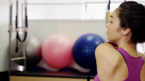 Beautiful woman exercising in fitness studio