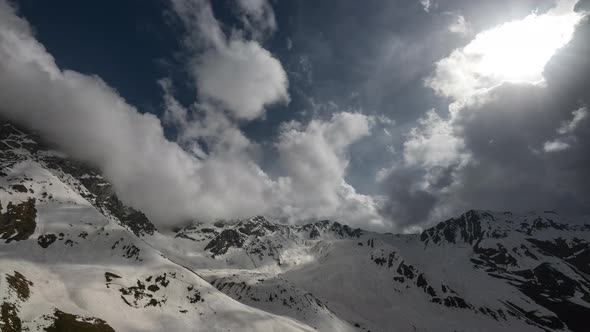 Timelapse of the Mountains and Clouds. at First Sunny but Then It Gets Dark