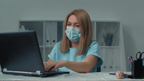 Tired Woman in Protectiva Mask Touching Head Working Hard on Laptop Upset Exhausted Office Work