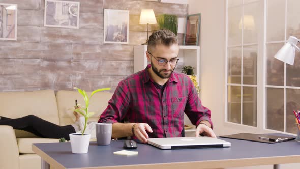 Zoom in Shot of Handsome Freelancer Opening Laptop in Living Room