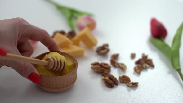 Sweet Honey and Nuts Isolated on White Background