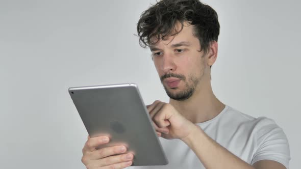 Young Casual Man Browsing Internet on Tablet