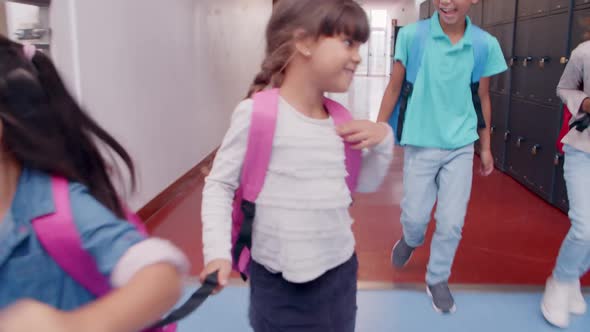 Diverse Group of Schoolkids of Different Ages Running