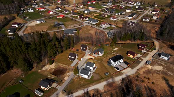 Aerial Pan Up Residential Houses with Cellular Tower in Centre