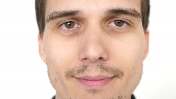 Portrait of Young Attractive Successful Smiling Man on a White Background