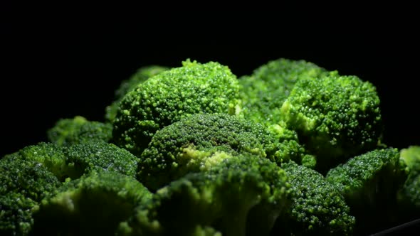 Broccoli Gyrating with Black Background