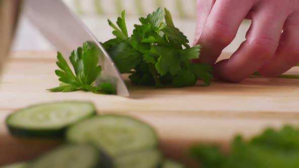 Chopping Italian parsley, closeup