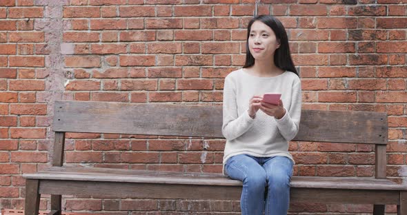 Woman use of smart phone at university campus