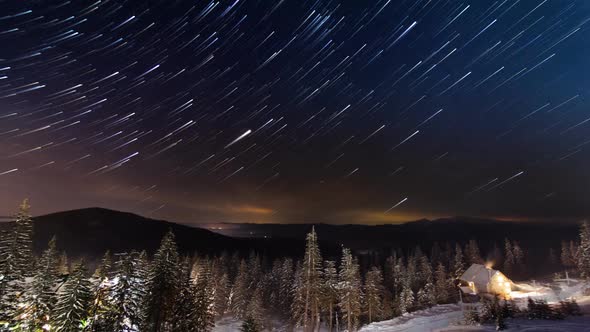 Stars Moving Above Small House In The Mountains In WInter, Ukraine, Carpathian