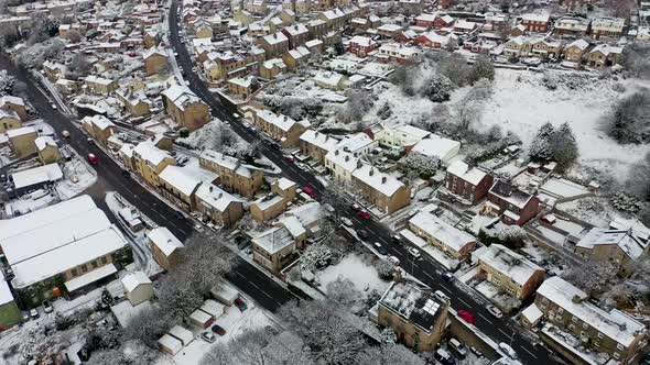 Aerial footage in the winter time on a snowy day of the British town of Mirfield in Kirklees
