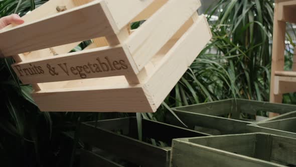 Girl Put Wooden Box with Inscription Fruits and Vegetables