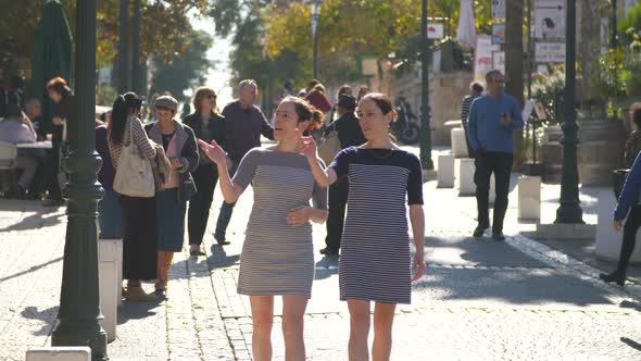 Two Caucasian female identical twins spending quality time together