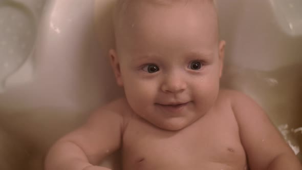 Happy Baby Girl Bathing