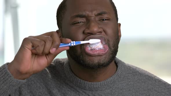 Close Up Afro-american Man Brushing His Teeth.