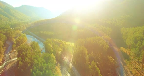 Low Altitude Flight Over Fresh Fast Mountain River with Rocks at Sunny Summer Morning.