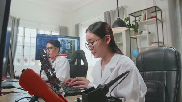 Asian Female Engineer Works On Computer With Cad Programming Software