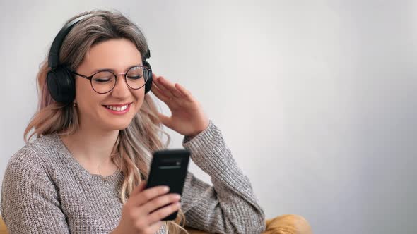 Cheerful Woman Wearing Headphones Enjoying Audio Sound