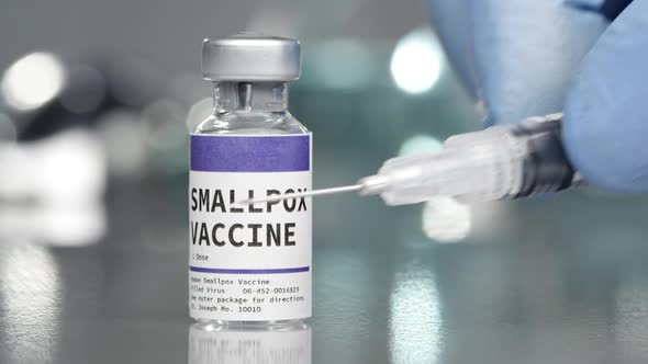 SmallPox vaccine vial in medical lab with syringe