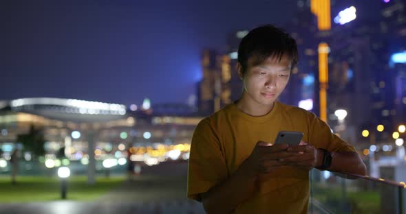 Man use of mobile phone at night