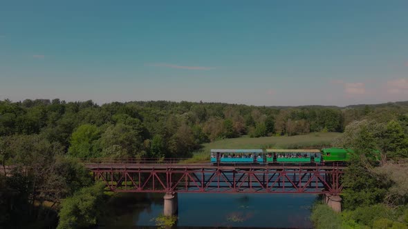 Aerial view on a train slowly crossing the river