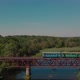 Aerial view on a train slowly crossing the river - VideoHive Item for Sale