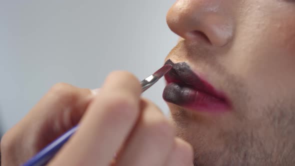 Close Up of Blending Lipstick on Handsome Man