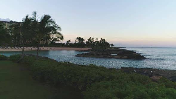 Scenic Ko Olina Resort, waterfront bay at sunset soft lights. Aerial view