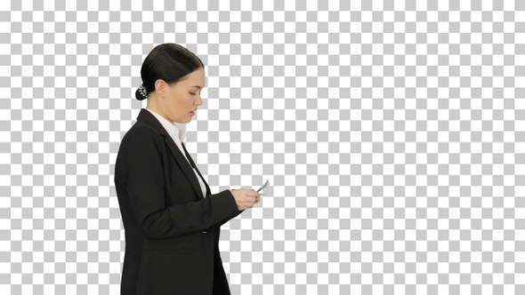 Young woman in a suit counting money, Alpha Channel