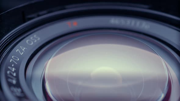 the lens of a movie camera or photo camera is shot in close-up