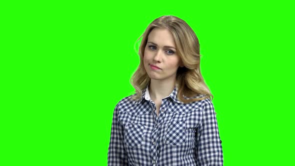 Young Woman with Distrustful Look on Green Screen