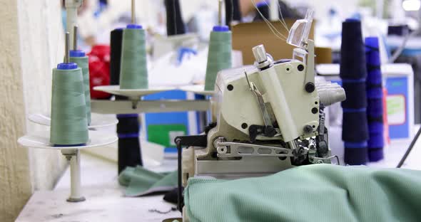 Tailor working on electric sewing machine