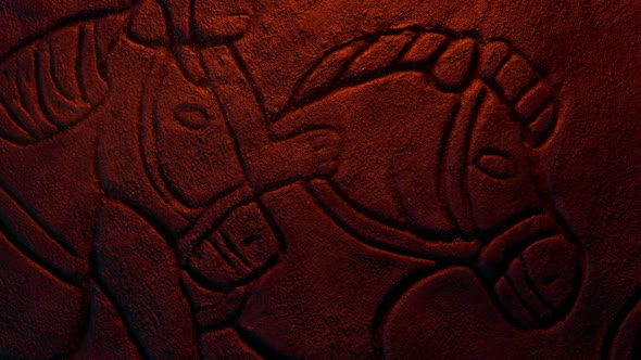 Horses Old Rock Carving In Firelight With Dust