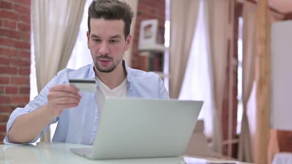 Online Shopping By Young Man Using Bank Card