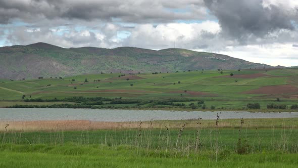 Green Moorland and Fields Around The Lake