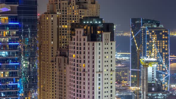 Aerial View of Modern Skyscrapers and Beach at Jumeirah Beach Residence JBR Night Timelapse in Dubai