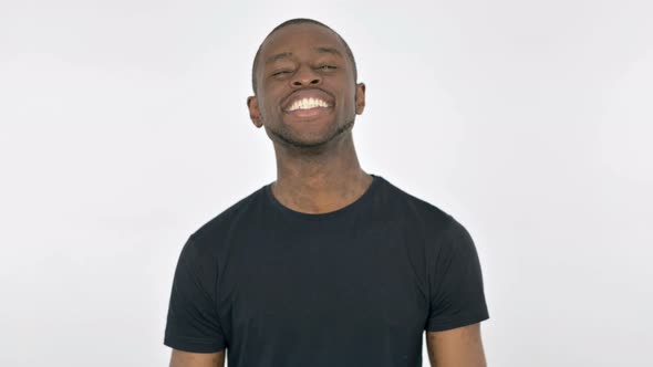 Young African Man Shaking Head As Yes Sign on White Background