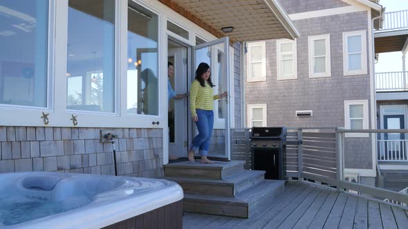 Couple walk out to see view from balcony