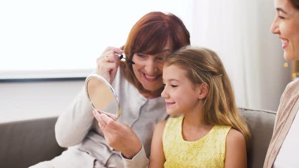 Mother, Daughter and Grandmother Doing Make Up