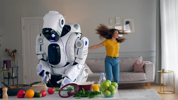 The Lady Is Jumping Around While the Cyborg Is Cooking